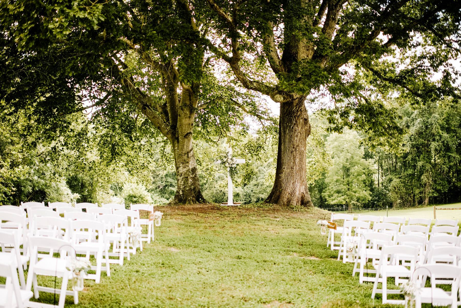 Outdoors wedding under the large oak trees at Malden Hill Venue in Aylett, Virginia 